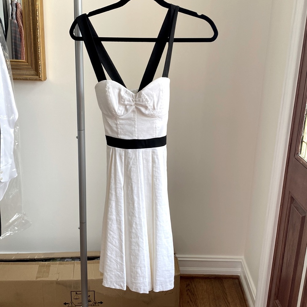 White sundress with black embellishments